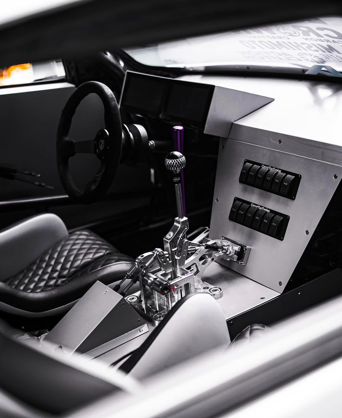 Custom fabricated aluminum center console with billet shifter and switch panel